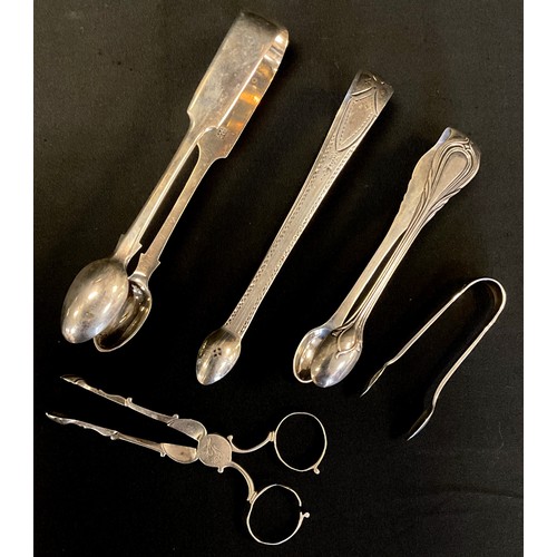 310 - A pair of George III silver bright cut sugar tongs, Samuel Godbehere & Edward Wigan, London 1792;  o... 