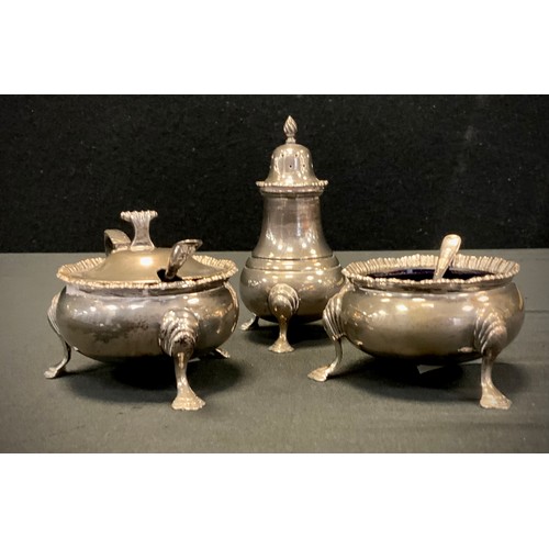 316 - A George III style silver three piece cruet set including salt, mustard and pepper condiment pots, B... 