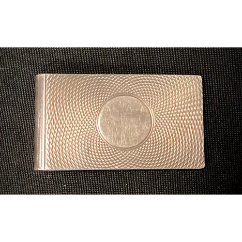 320 - An Elizabeth II silver money clip, engine turned and centred by a vacant cartouche, Birmingham 1982