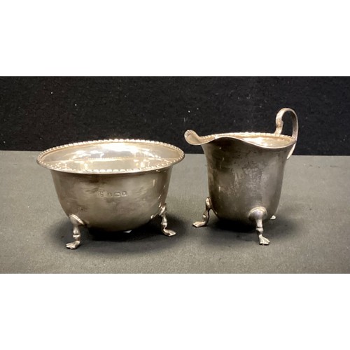 327 - A George VI silver milk jug and sugar bowl, Northern Goldsmiths Co, Birmingham 1941, 3.67ozt (2)