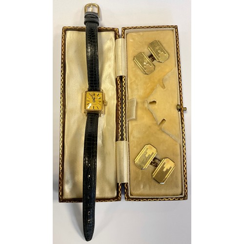 294 - Watches - a Tissot lady's 1061 9ct gold cased wristwatch, stem wind movement, black leather strap, 1... 