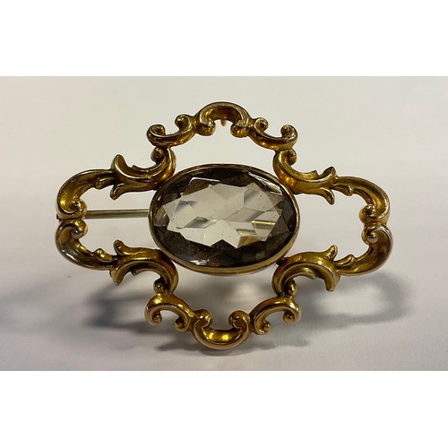 295 - A Victorian smoky quartz 9ct gold mounted panel brooch, stamped 9ct, 4.3cm long, 9.6g gross