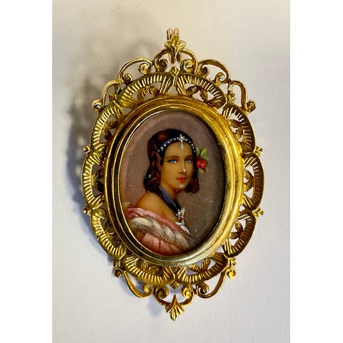 299 - A 19th century style oval hand painted portrait miniature pendant brooch, Girl in Evening Dress with... 