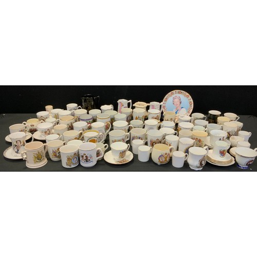 97A - A collection of Commemorative cups and beakers including; a beaker celebrating the Coronation of Kin... 