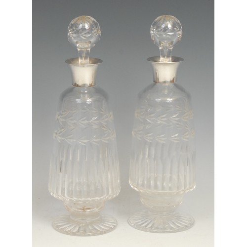 70 - A pair of George V silver mounted cut glass ovoid pedestal liqueur decanters, 25cm high, William Dea... 