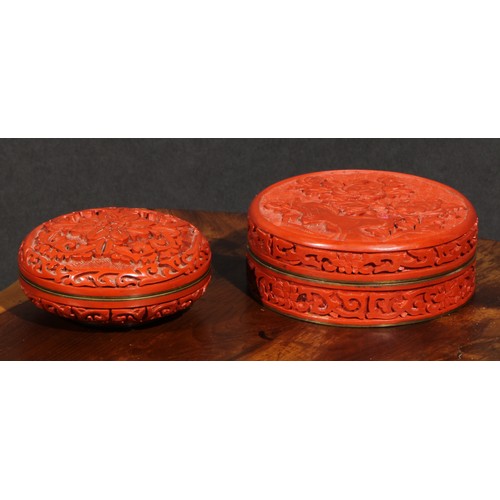 93 - A Chinese cinnabar lacquer circular box and cover, carved in relief with chrysanthemums on a diaper ... 