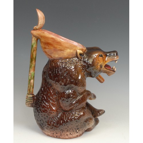 153 - A Victorian majolica novelty syrup jug, by Joseph Holdcroft, as a seated bear holding a spoon, impre... 