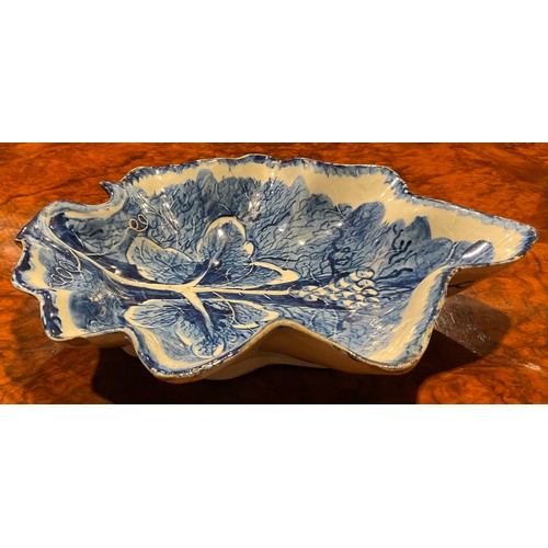 164 - A near pair of large Bow leaf shaped dishes, painted in dark blue with grape and vine, the largest 2... 