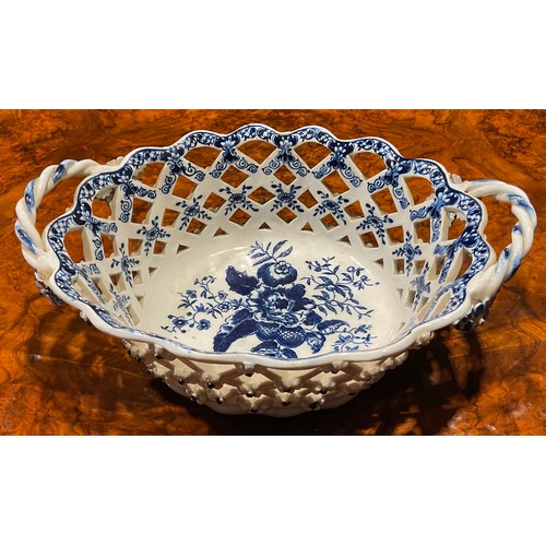 169 - An Lowestoft two-handled oval basket, central oval reserve painted in underglaze blue with flowers, ... 