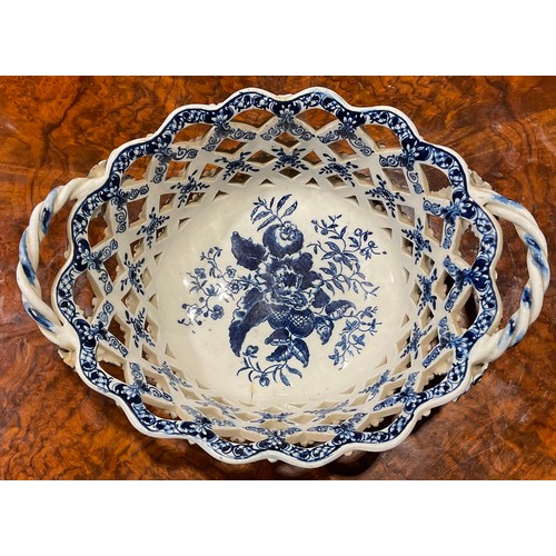 169 - An Lowestoft two-handled oval basket, central oval reserve painted in underglaze blue with flowers, ... 