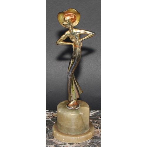 175 - An Art Deco gilt and silvered figure, a lady of fashion, onyx plinth, 20.5cm high, c.1940