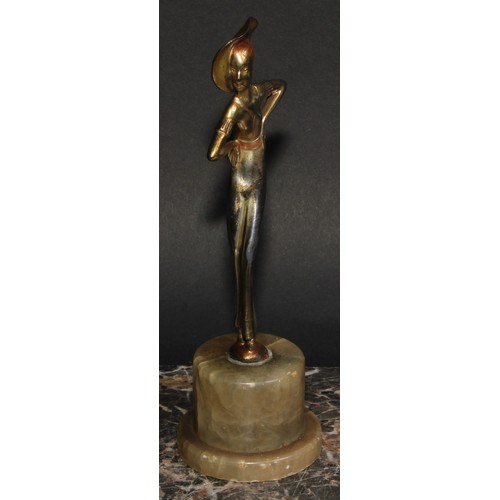 175 - An Art Deco gilt and silvered figure, a lady of fashion, onyx plinth, 20.5cm high, c.1940