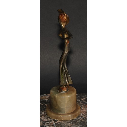 175 - An Art Deco gilt and silvered figure, a lady of fashion, onyx plinth, 20.5cm high, c.1940