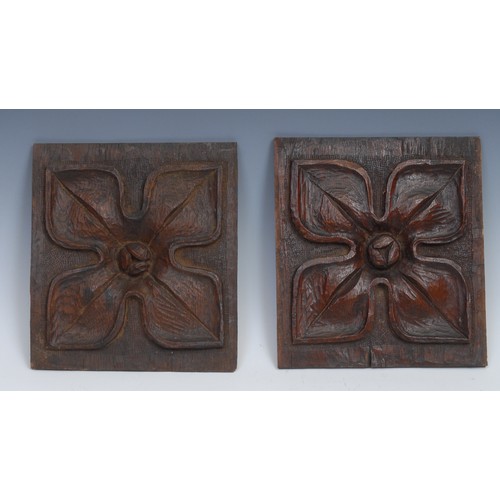 203 - A 19th century oak lozenge shaped panel, carved in relief with a Classical urn, 22cm x 12cm; another... 