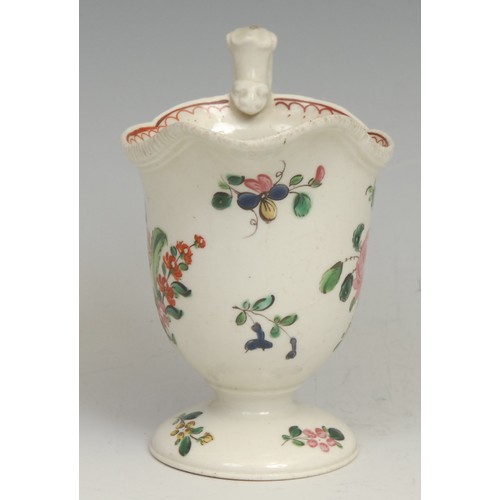 248 - A Liverpool helmet shaped pedestal cream jug, painted in polychrome with flowers, red double-line pe... 