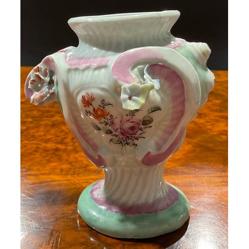 249 - A Longton Hall asymmetric Rococo style pedestal vase, painted with flowers within moulded cartouches... 