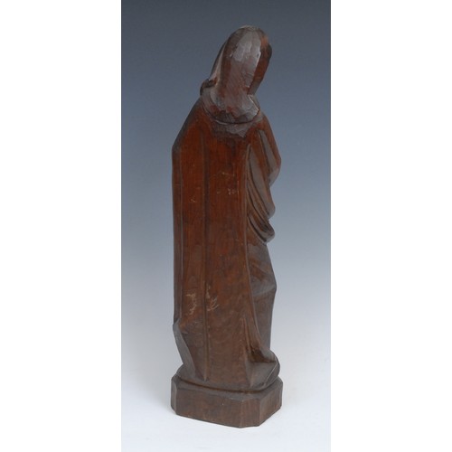 312 - A Continental softwood ecclesiastical carving, Madonna and Child, canted rectangular base, 41cm high... 