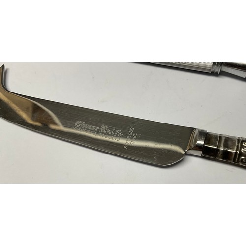 329 - An Elizabeth II silver hafted Queens pattern bread knife, carving knife, knife sharpener and cheese ... 