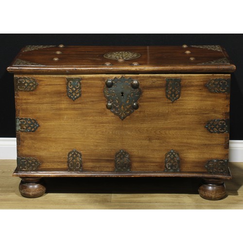 185 - A Zanzibar hardwood chest, typically brass mounted, hinged cover enclosing a till, carrying handles ... 