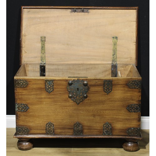 185 - A Zanzibar hardwood chest, typically brass mounted, hinged cover enclosing a till, carrying handles ... 