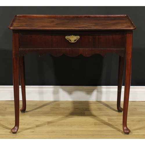 186 - A George II mahogany silver table, dished rounded rectangular top above a long frieze drawer, shaped... 