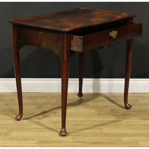 186 - A George II mahogany silver table, dished rounded rectangular top above a long frieze drawer, shaped... 