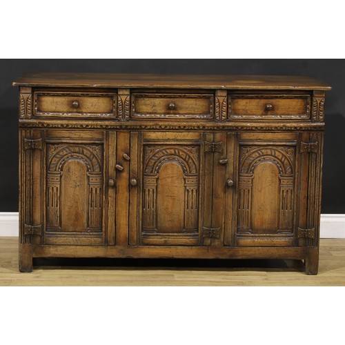 187 - A 17th century style oak low dresser or side cabinet, by Titchmarsh & Goodwin, 84cm high, 137cm wide... 