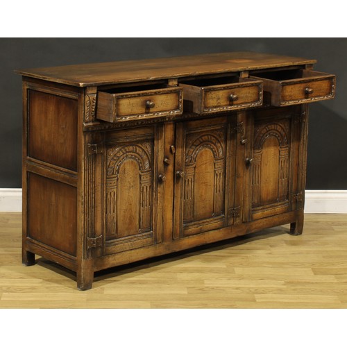 187 - A 17th century style oak low dresser or side cabinet, by Titchmarsh & Goodwin, 84cm high, 137cm wide... 