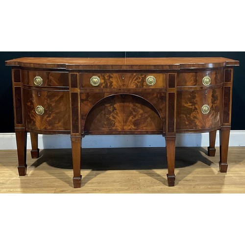 190 - A George III mahogany serving table or sideboard, slightly oversailing top above an arrangement of d... 