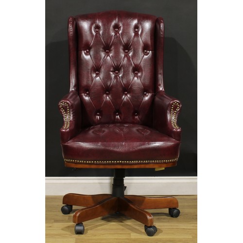 198 - A contemporary swivel desk chair, Chesterfield type upholstery, 119.5cm high, 67cm wide, the seat 48... 