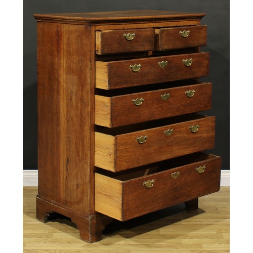 273 - A George II oak chest, of unusual proportions, rectangular top above two short and four long graduat... 