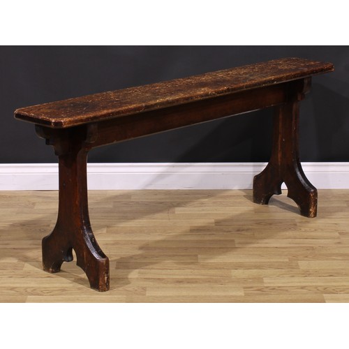 277 - A late Victorian Gothic Revival vernacular pine bench, chamfered rectangular top, shaped end support... 