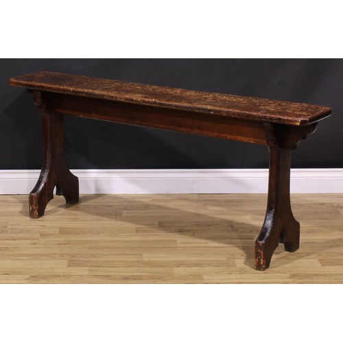 277 - A late Victorian Gothic Revival vernacular pine bench, chamfered rectangular top, shaped end support... 