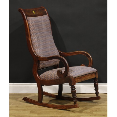 283 - A 19th century mahogany rocking chair, 106.5cm high, 56cm wide, the seat 48cm wide and 42cm deep