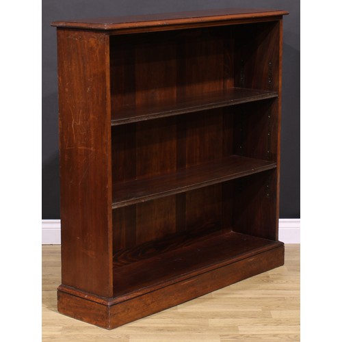 285 - An early 20th century mahogany open bookcase, oversailing top above two adjustable shelves, plinth b... 