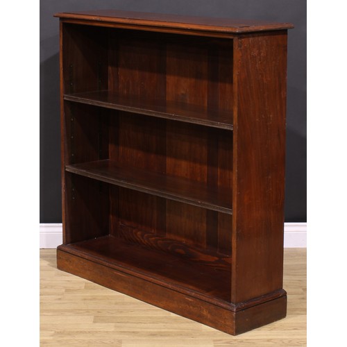 285 - An early 20th century mahogany open bookcase, oversailing top above two adjustable shelves, plinth b... 