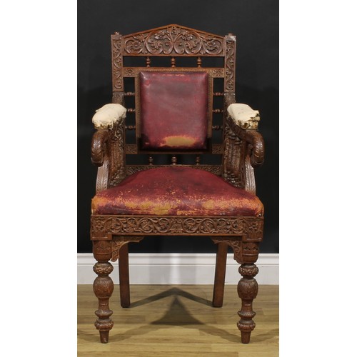 367 - A pair Anglo-Indian hardwood armchairs, carved throughout with scrolls, flowers and typical motifs, ... 