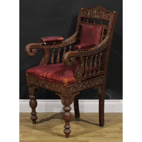 367 - A pair Anglo-Indian hardwood armchairs, carved throughout with scrolls, flowers and typical motifs, ... 