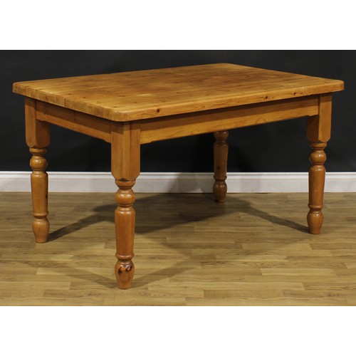 370 - A farmhouse pine dining table, 77cm high, 137cm long, 91cm wide; a set of six lath back side chairs,... 