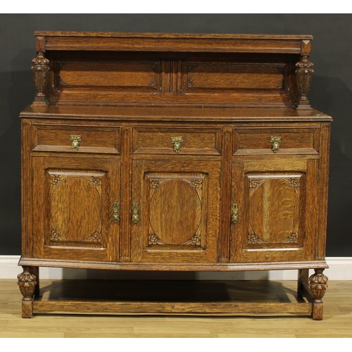 373 - An Elizabethan Revival oak buffet sideboard, 128cm high, 136.5cm wide, 48cm deep, c.1925