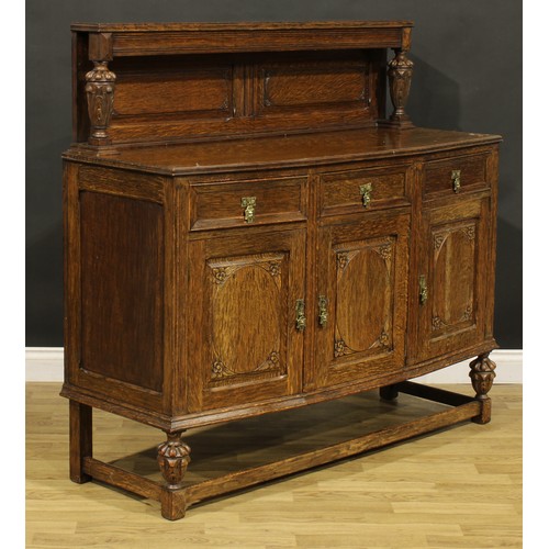 373 - An Elizabethan Revival oak buffet sideboard, 128cm high, 136.5cm wide, 48cm deep, c.1925