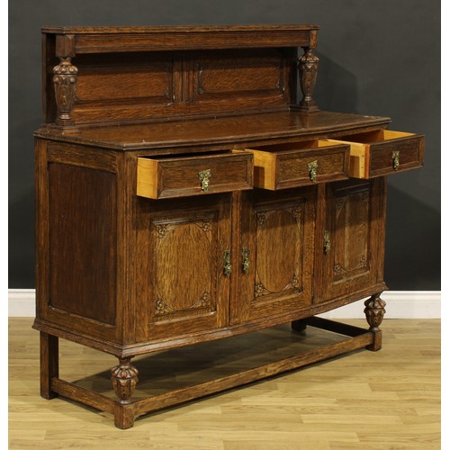 373 - An Elizabethan Revival oak buffet sideboard, 128cm high, 136.5cm wide, 48cm deep, c.1925