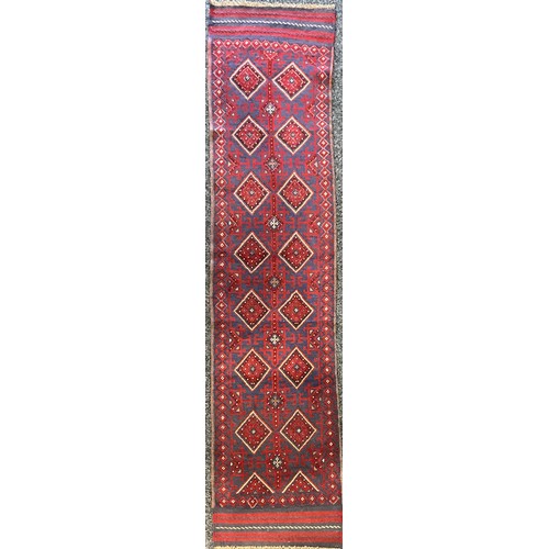 457 - Oriental Carpets - a hand knotted woollen Meshwani runner, 258cm x 58cm