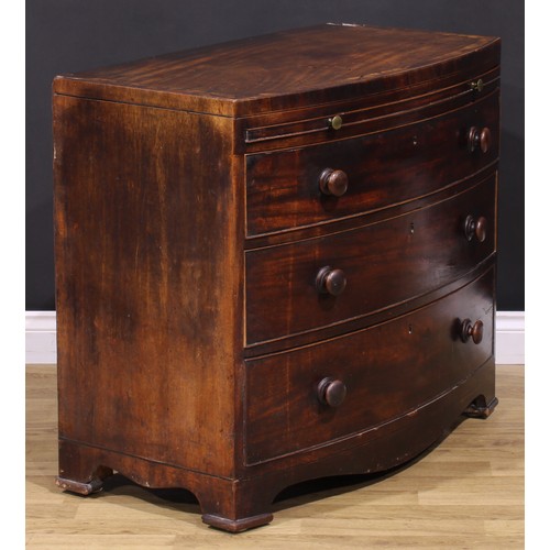 377 - A George III mahogany bowfront bachelor’s chest, caddy top above a slide and three long graduated co... 