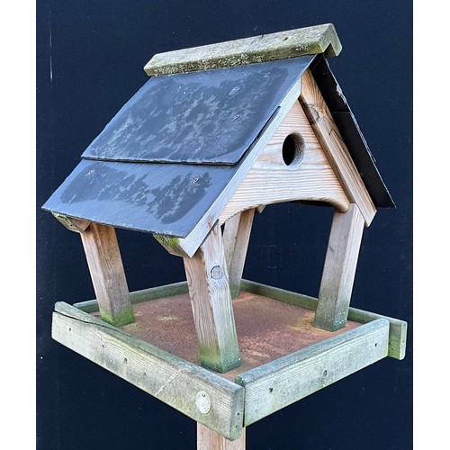 440 - A garden bird table, 181cm high, the plateau 44cm x 50cm, the base 79cm square