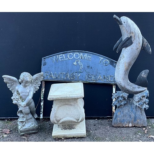 445 - An aluminium garden sign, Welcome To Fantasy Island; a painted softwood model, dolphin, 96.5cm high;... 