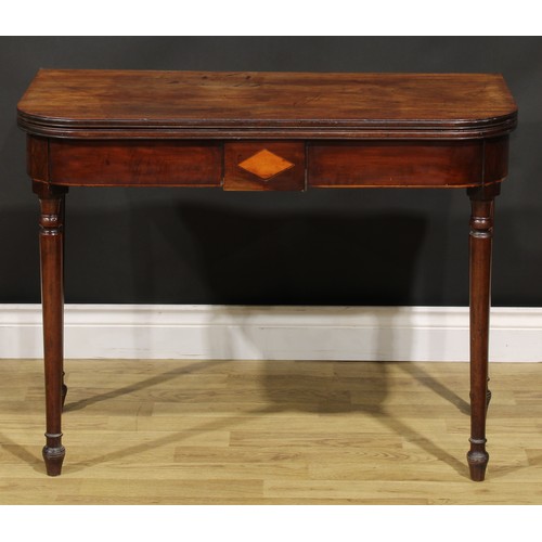 377A - A George III mahogany tea table, hinged top above a deep frieze inlaid with a satinwood lozenge and ... 