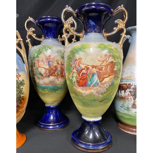 537A - Continental Ceramics - a pair of Austrian slender ovoid two-handled vases, printed in polychrome wit... 