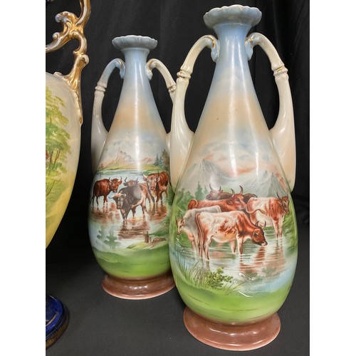 537A - Continental Ceramics - a pair of Austrian slender ovoid two-handled vases, printed in polychrome wit... 