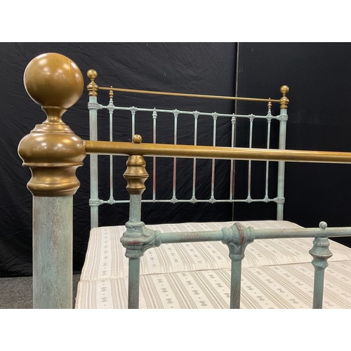 44 - A Victorian cast iron and brass King size bed frame, refurbished by ‘Seventh Heaven’ Antique bedstea... 
